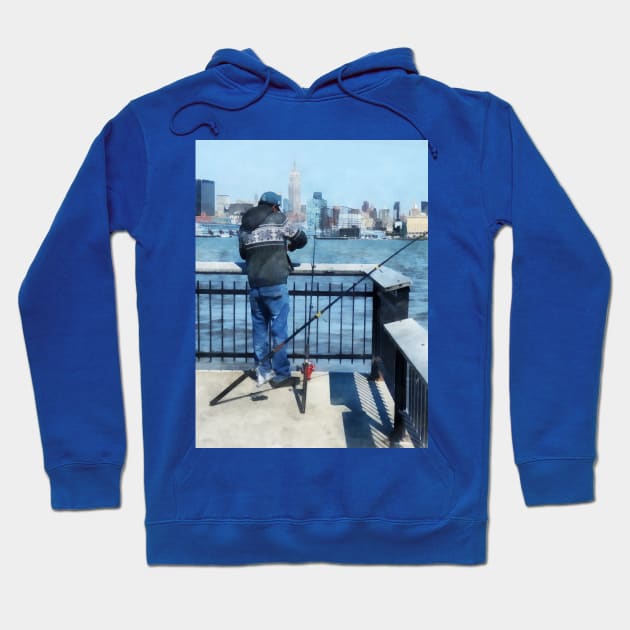 Hoboken NJ - Man Fishing Off Hoboken Pier Hoodie by SusanSavad